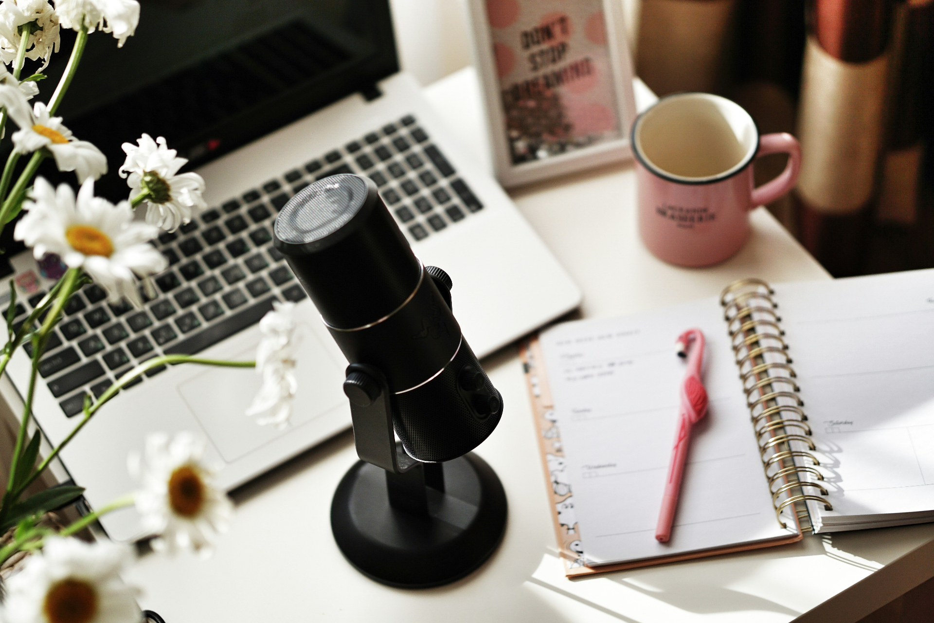 Podcast microphone on a workspace desk — build digital authority through media placements and thought leadership