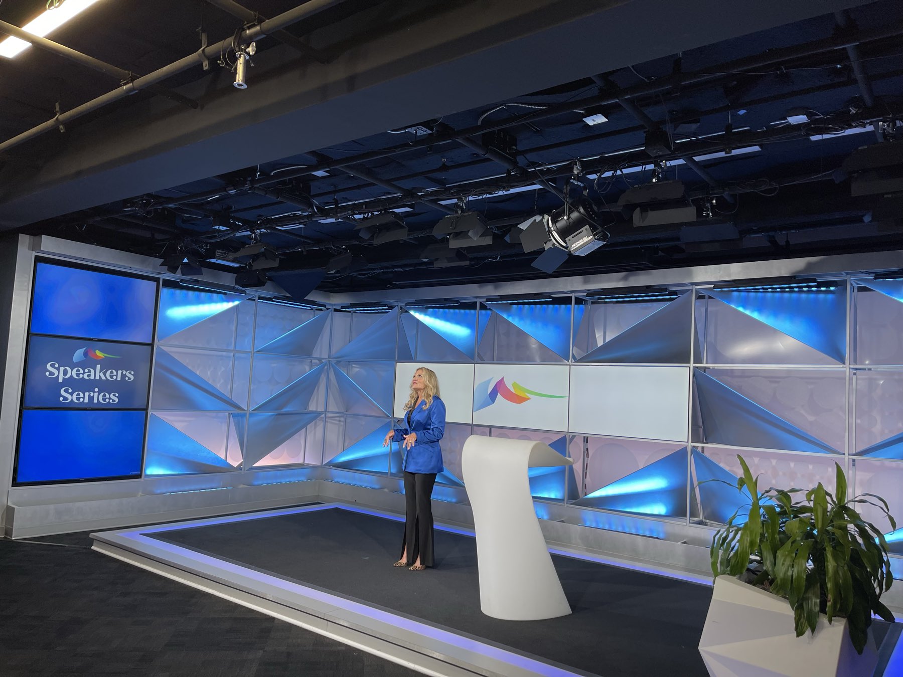 A speaker delivering her talk on the studio stage